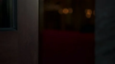 Man opens a beautiful metal handle from wooden hotel door. Check-in registration Video stock 164559452