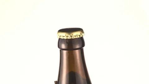 Man opens the beer bottle with a corkscrew Stock Footage 106216052