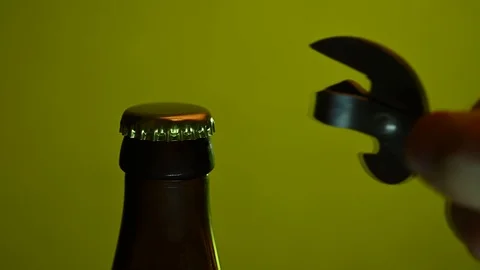 Man opens beer opener closeup Stock Footage 119369401