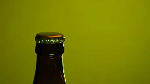 Man opens beer opener closeup Stock Footage 119369571