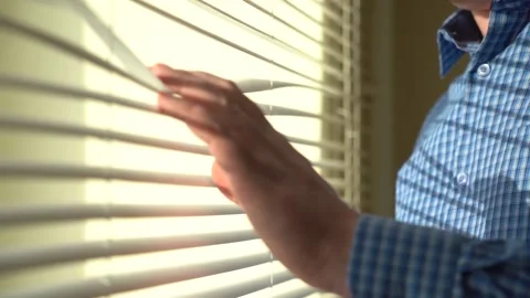 The Man Opens the Blinds in the Window. Office work concept. Side view Stock Footage 151772851