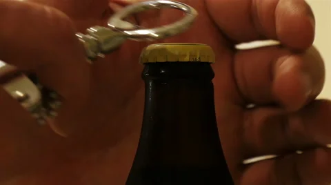 Man opens a bottle of beer Stock Footage 50186794