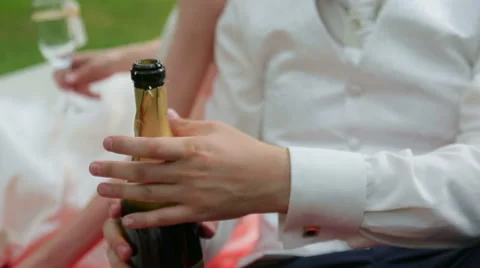 A man opens a bottle of champagne Stock Footage 45836579
