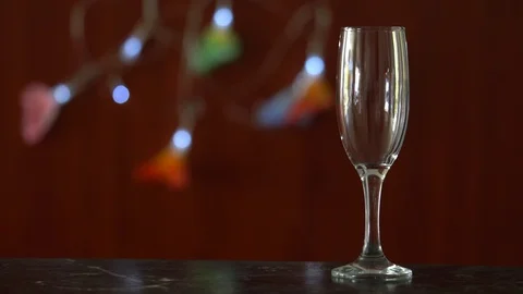 A Man Opens A Bottle Of Champagne or Wine And Pours Into The Glass Stock Footage 96475962