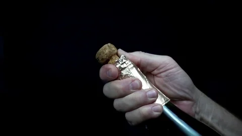 Man opens a bottle of champagne in slow motion. Stock Footage 84031242