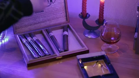 The man opens a box of cigars and one. Stock Footage 83686061