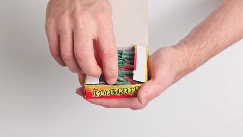 A man opens a box of firecrackers Vídeos de archivo 267300567