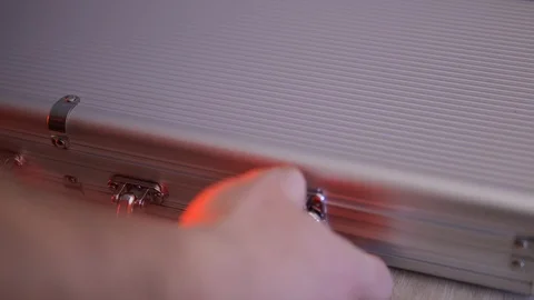 A man opens a box with poker chips in casino. He pulls out the chips and throws Stock Footage 124132320