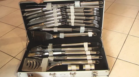 Man opens a box with tools for grilling Stock Footage 46794862