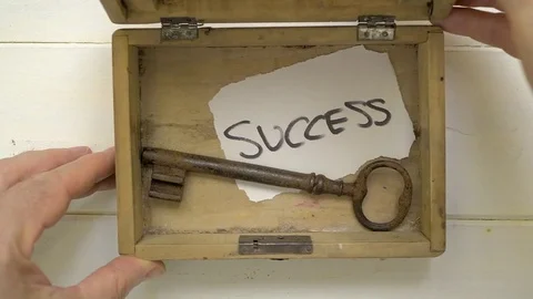 A man opens a box in which there is a key for success Stock Footage 74513951