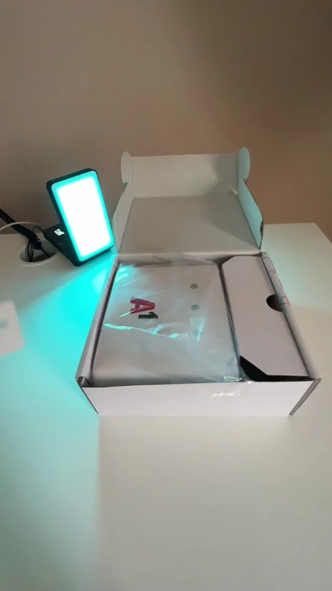 A man opens a box with a wi-fi router, unpacking the goods Stock Footage 237761600