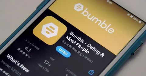 Man opens Bumble app from App Store on iPhone Stock Footage 149426264