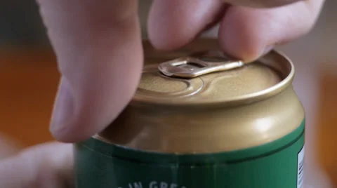 Man opens can of beer Stock Footage 36478701