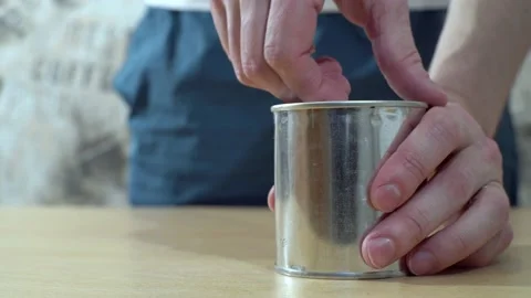 A man opens an can Stock Footage 168402618