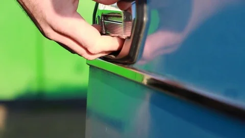 A man opens the car door and closes it back Stock Footage 85282290