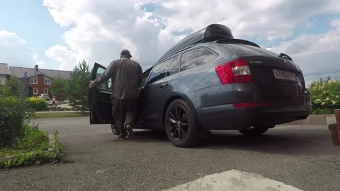 The Man Opens The Car Door, Sits On The Driver Seat and Drive Away Video stock 139619071