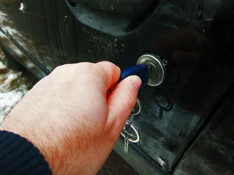 A man opens the car with the key Stock Photos