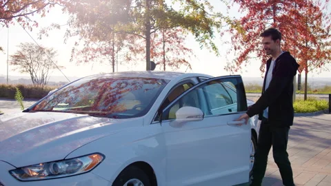 Man opens car-sharing vehicle via mobile app on phone Stock Footage 300487276