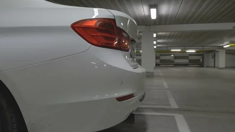 Man opens the car trunk and putting in a bag Stock Footage 85402317