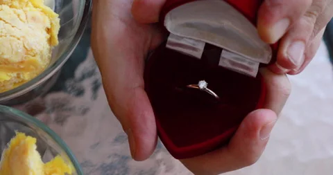 A man opens a case with a wedding ring (close-up) Video stock 243212764