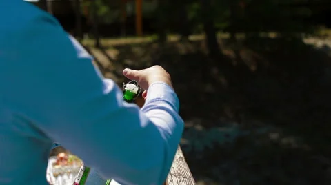 Man opens champagne in the outdoor Stock Footage 60004294