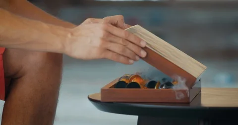 Man opens chess game box with smog and put out the figures Stock Footage 104619727