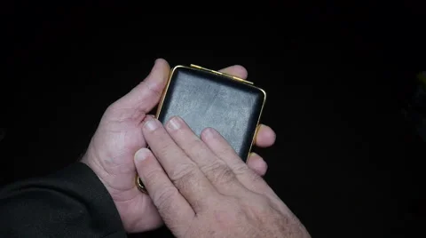 Man opens cigarette case wallet Stock Footage 56925551