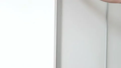 The man opens the closet and chooses his shoes Stock Footage 135808971