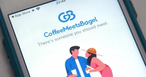 Man opens Coffee Meets Bagel app (often Abbreviated as CMB) on iPhone Stock Footage 149426385