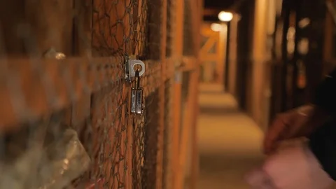 Man opens a combination lock on a storage room Stock Footage 102281893