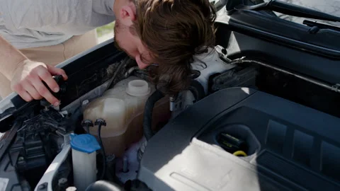The man opens the cover where the anti-milling tool is and checks if it needs to Stock Footage 276348682