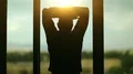 Man opens the curtains in the morning raises his hands and stretch oneself HD Footage