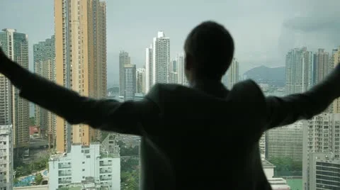 Man opens curtains on the view Hong Kong Stock Footage