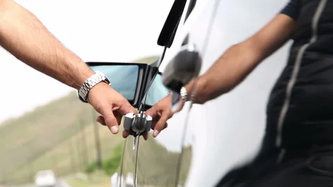 Man opens the door and gets into the car Video stock 147352381