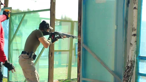 Man opens the door and shoot at targets Stock Footage 27786099