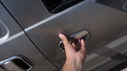 Man opens the door of the car and is going to sit in it Video stock 103075822