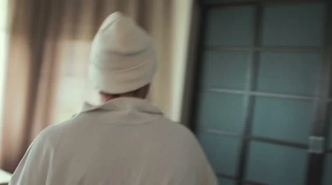 Man opens the door to dark room Stock Footage 64243124