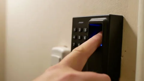  A man opens a door lock using a biometric sensor. Stock Footage 143484748
