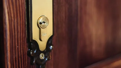 The man opens the door using the key Video stock 48048923