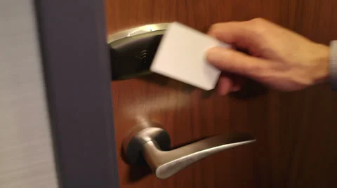 Man opens door using security key card Stock Footage 35573849
