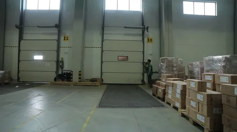 Man opens the door to the warehouse Video stock 64018061
