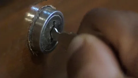 Man Opens The Drawer Lock With Key Stock Footage 310693991