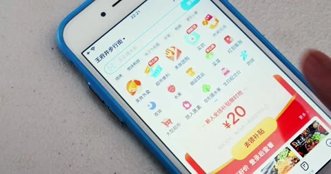 Man opens ele.me app and watches its opening screen on an iPhone Stock Footage 175219803