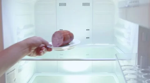 The man opens the empty fridge and puts back the sausage, close up Stock Footage 67717730