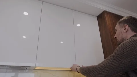 Man opens empty kitchen locker Stock Footage 130116339