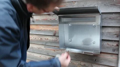 Man opens empty letterbox Stock Footage 12402709