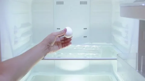 The man opens the empty refrigerator and takes out the last egg Video stock 67717716