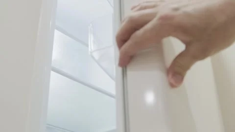Man opens an empty refrigerator, slow motion 스톡 동영상 271071196