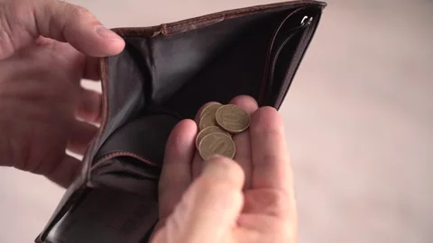 A man opens an empty wallet, showing a lack of funds Stock Footage 303361638
