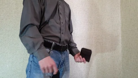 The man opens an empty wallet. Wallet without money. Stock Footage 106109913